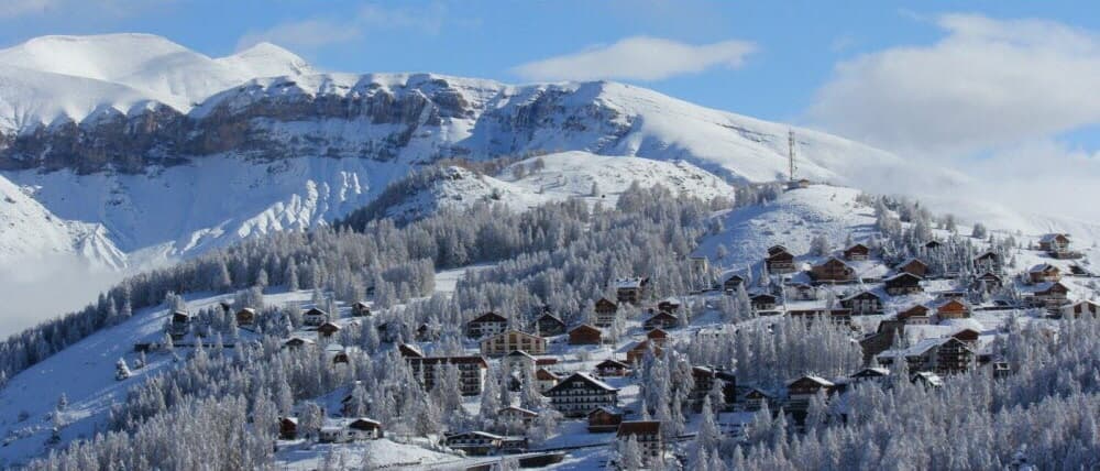 South Alps village under the snow by a beautiful sunny day