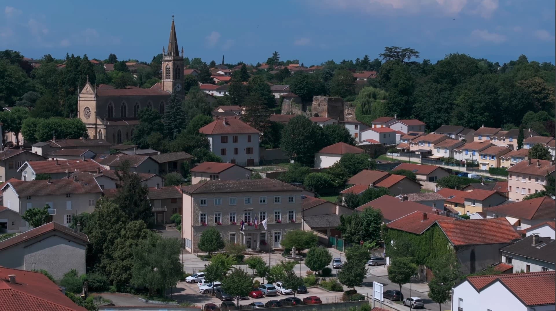French village view with its townhall and church
